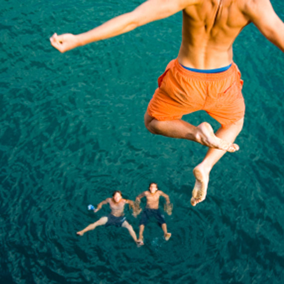 Cliff jumping into a lake